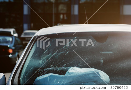 broken windshield from car accident. broken windshield from car accident. 89760423