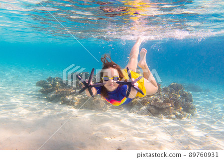 Child snorkeling. Kids underwater. Beach and sea. 89760931