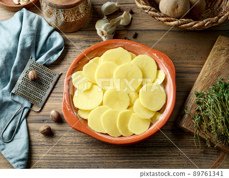 raw sliced potatoes raw sliced potatoes 89761341