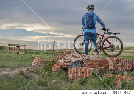 male cyclist with a gravel bike 89761437