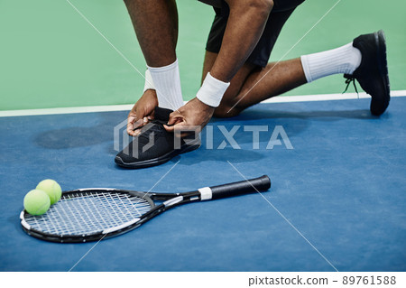 Tennis Player Tying Sports Shoes Tennis Player Tying Sports Shoes 89761588