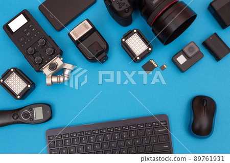 Workplace With Digital Gadgets on Blue Table Workplace With Digital Gadgets on Blue Table 89761931
