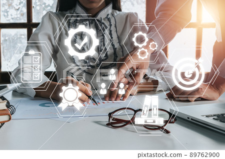 Quality management with QA (assurance), QC (control) and improvement, Business team discussing data with document data with VR screen quality management icon on desk table.. 89762900
