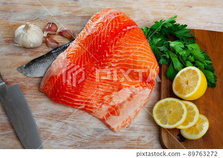 Fresh raw salmon fillet on wooden table Fresh raw salmon fillet on wooden table 89763272