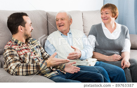 Grandparents and grandson talk 89763387