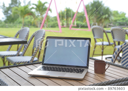 PC placed on the table on the terrace 89763603