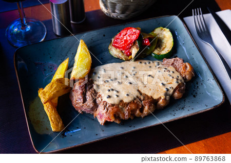Delicious grilled beef steak with potatoes and vegetables 89763868