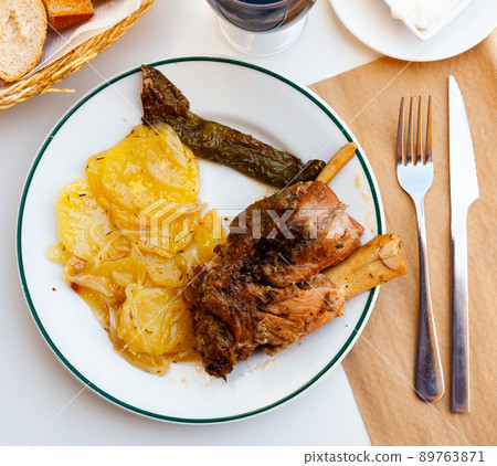Delicious pork knuckle with potatoes Delicious pork knuckle with potatoes 89763871