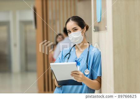 Female doctor stands at hospital. Healthcare worker.  89766625