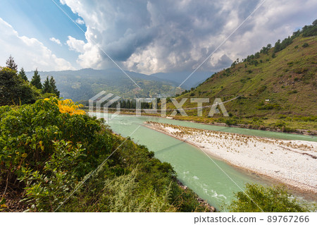 The Punakha Suspension Bridge at the Punakha Dzong. Across the Tsang Chu River to Shengana and Wangkha village. The longest suspension bridge in Bhutan and always decorated with colorful prayer flags. The Punakha Suspension Bridge at the Punakha Dzong. Across the Tsang Chu River to Shengana and Wangkha village. The longest suspension bridge in Bhutan and always decorated with colorful prayer flags. 89767266