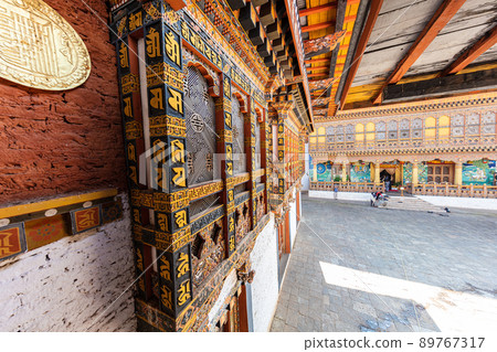 Bhutan - October 24, 2021: Inside  Punakha Dzong in Bhutan. Punakha Dzong Monastery, one of the largest monasteries in Asia. The delicate decoration inside of punakha dzong, Bhutan. traditional facade 89767317