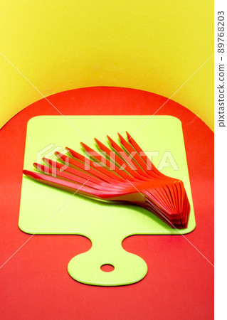 Abstract still life with red forks on a kitchen board 89768203
