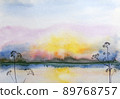 Blue watercolor illustration of multicolored sunset on sea with forest on horizon. 89768757