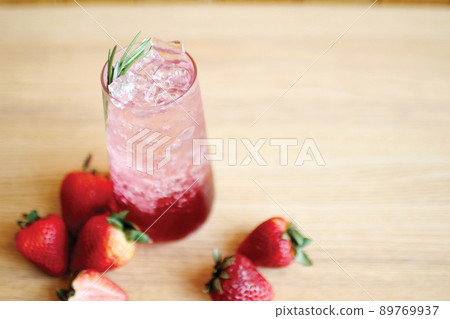 Strawberry italian soda with strawberry on the table Strawberry italian soda with strawberry on the table 89769937