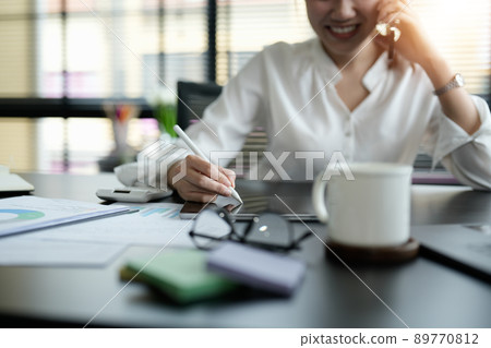 Close up business woman hand holding stylus pen and digital tablet for planning working schedule in office Close up business woman hand holding stylus pen and digital tablet for planning working schedule in office 89770812