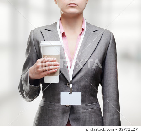 Business woman with a tumbler of coffee 89772127