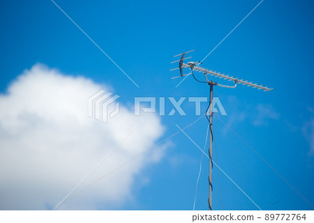 Antenna, blue sky and clouds Antenna, blue sky and clouds 89772764