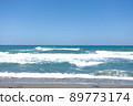 blue sky with green ocean waves 89773174