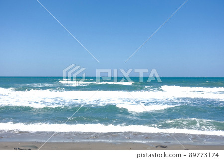 blue sky with green ocean waves 89773174