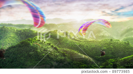 Paragliding multicolor. Paraglider flying over Landscape from the background Beauty nature mountain landscape of the sky. 89773985