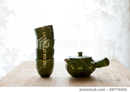 chinese tea set on table. Studio green tea elements or healthy background.japanese green tea cups chinese tea set on table. Studio green tea elements or healthy background.japanese green tea cups 89774060