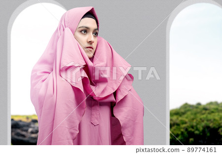 Asian Muslim woman in veil in praying position (salat) Asian Muslim woman in veil in praying position (salat) 89774161