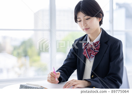 Portrait of a high school girl studying 89775064