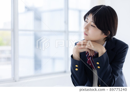 High school girl looking out the window High school girl looking out the window 89775240