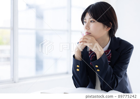 High school girl looking out the window 89775242