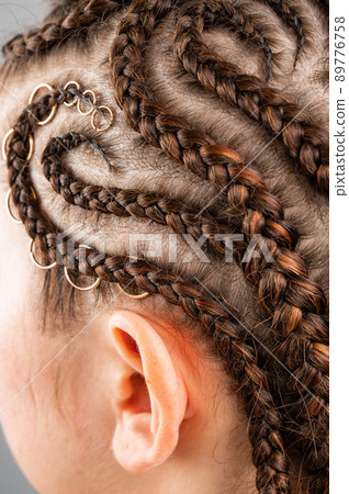 Close-up of braids on the head of a caucasian woman. Close-up of braids on the head of a caucasian woman. 89776758