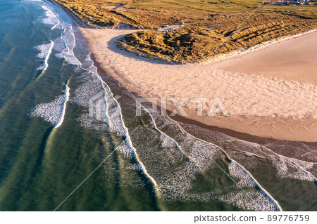 Aerial of the Beautiful Blue Flag Beach, Killahoey Strand near Dunfanaghy, Donegal, Ireland Aerial of the Beautiful Blue Flag Beach, Killahoey Strand near Dunfanaghy, Donegal, Ireland 89776759