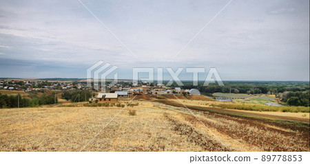 Panorama with a view of the Russian village, in summer on a cloudy day Panorama with a view of the Russian village, in summer on a cloudy day 89778853