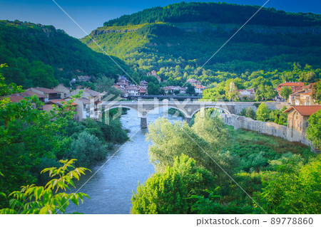 Beautiful summer view of the ancient bridge in Veliko Tarnovo, Bulgaria Beautiful summer view of the ancient bridge in Veliko Tarnovo, Bulgaria 89778860
