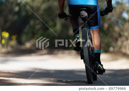 Mountain biking man riding on bike in summer mountains forest landscape 89779966