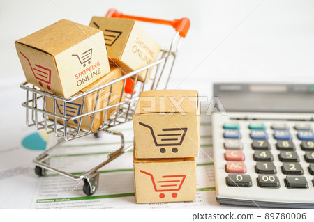 Online shopping, Shopping cart box on calculator, import export, finance commerce. Online shopping, Shopping cart box on calculator, import export, finance commerce. 89780006