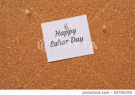 Happy labor day sticker nailed to chalkboard Happy labor day sticker nailed to chalkboard 89780209