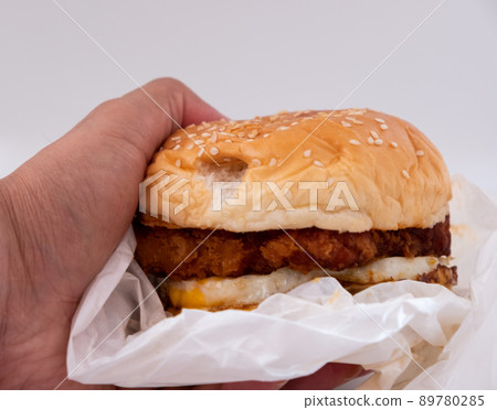 Closeup of big beef hamburger in food wrapping foil 89780285