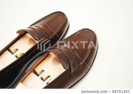 Standard leather shoes (coin loafers) shot on a white background Standard leather shoes (coin loafers) shot on a white background 89781265