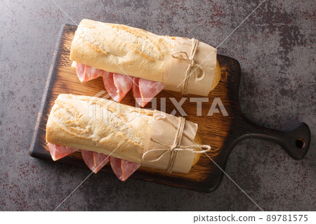 French Sandwich Jambon-Beurre made from a baguette with butter and ham closeup. Horizontal top view 89781575