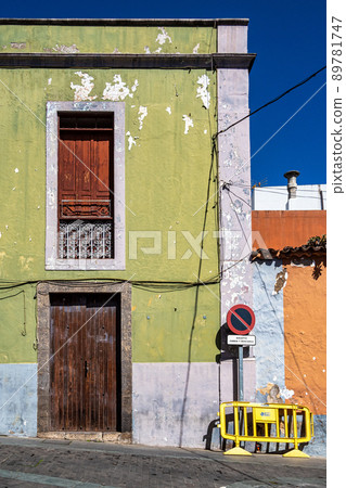 Teror at Gran Canaria, Spain. A beautiful traditional town with colorful houses with wooden balconies Teror at Gran Canaria, Spain. A beautiful traditional town with colorful houses with wooden balconies 89781747
