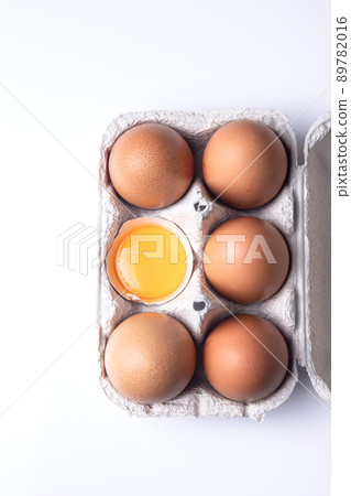 Top view of brown eggs on egg carton isolated on white background. 89782016