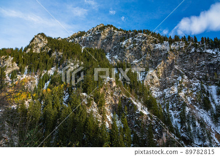 Snow-covered mountains and Perato canyon behind Neuschwanstein Castle, Germany 89782815