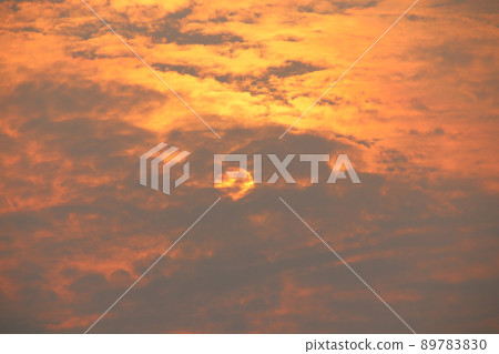 Orange light and sun with gray cloud covered. Orange light and sun with gray cloud covered. 89783830