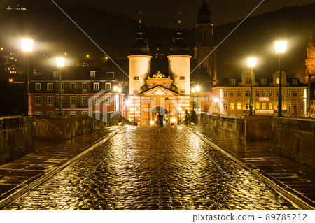 Alte Brücke and the bridge gate at night illuminated in Heidelberg, Germany 89785212