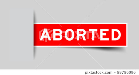 Inserted red color label sticker with word aborted on gray background 89786096