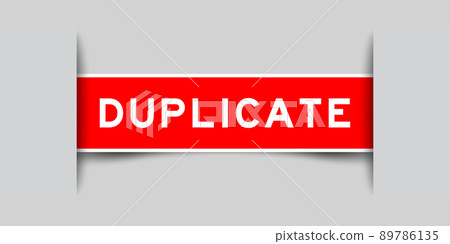 Inserted red color label sticker with word duplicate on gray background 89786135