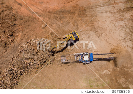 Aerial view on processing facility large industrial wood chip shredder Aerial view on processing facility large industrial wood chip shredder 89786506