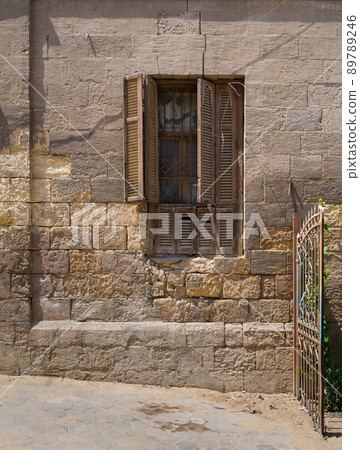 Broken windows and grunge stone bricks wall, Cairo, Egypt 89789246