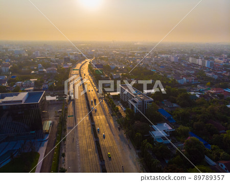 Aerial view morning sunrise city building with transport road 89789357