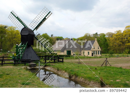 typical dutch village with a windmill near amsterdam typical dutch village with a windmill near amsterdam 89789442
